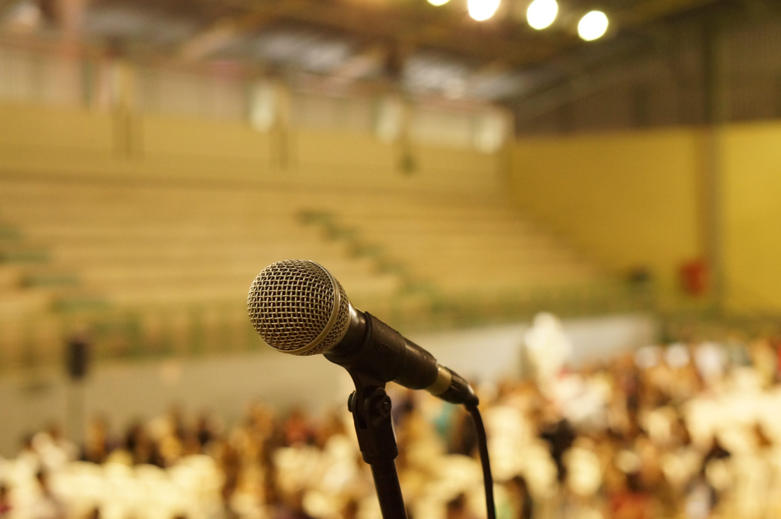 Microphone in front of conference crowd