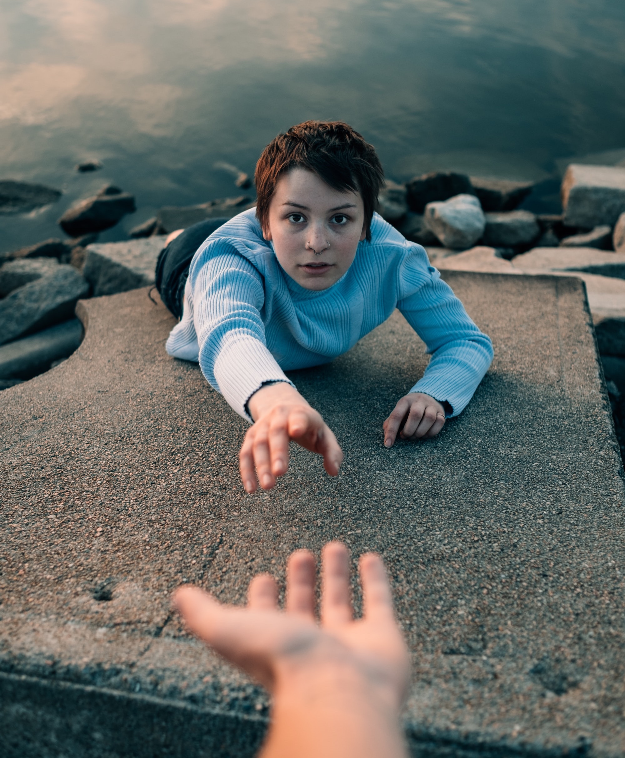 Photo of a woman reaching out for a helping hand